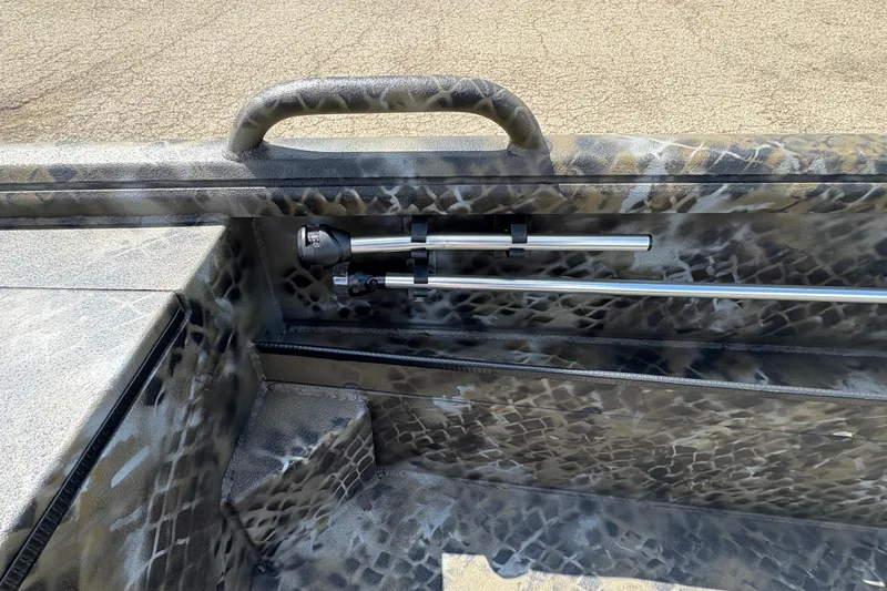 Slide: The Image of Interior of 2026 Excel Eclipse boat with camo pattern and mounted metal rods. - 20