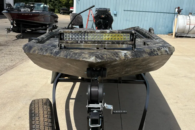 Slide: The Image of Camouflage-patterned Excel Eclipse 2026 boat on trailer with LED light bar. - 6