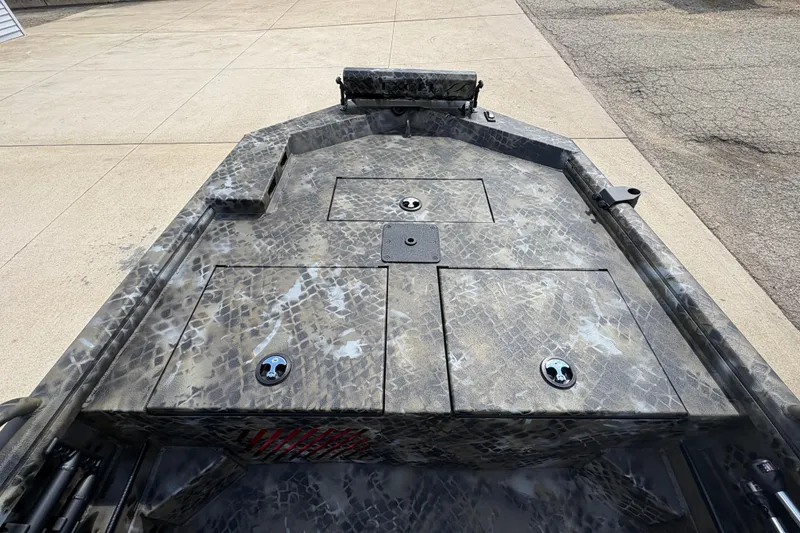 Slide: The Image of 2026 Excel Eclipse boat deck with camouflage pattern and storage compartments. - 8