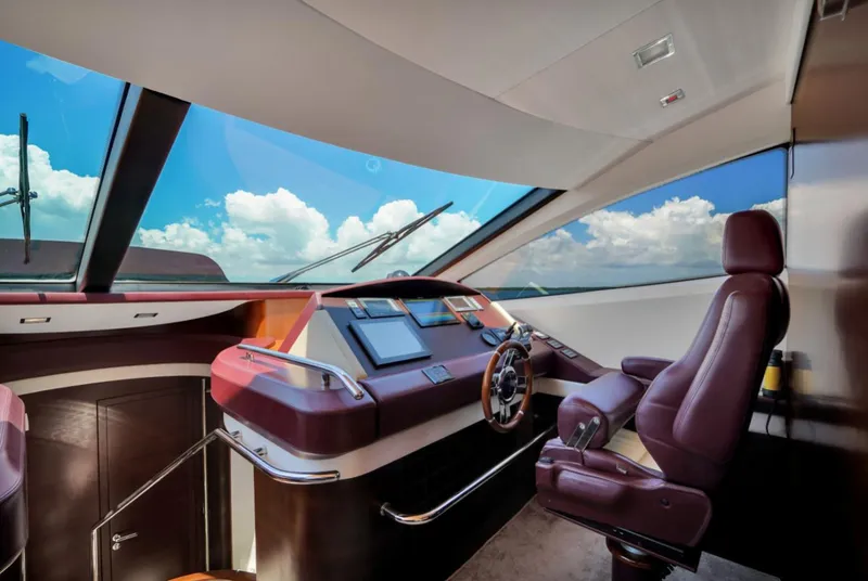Slide: The Image of Luxurious 2009 Azimut 75 yacht helm with panoramic windows and plush seating. - 29