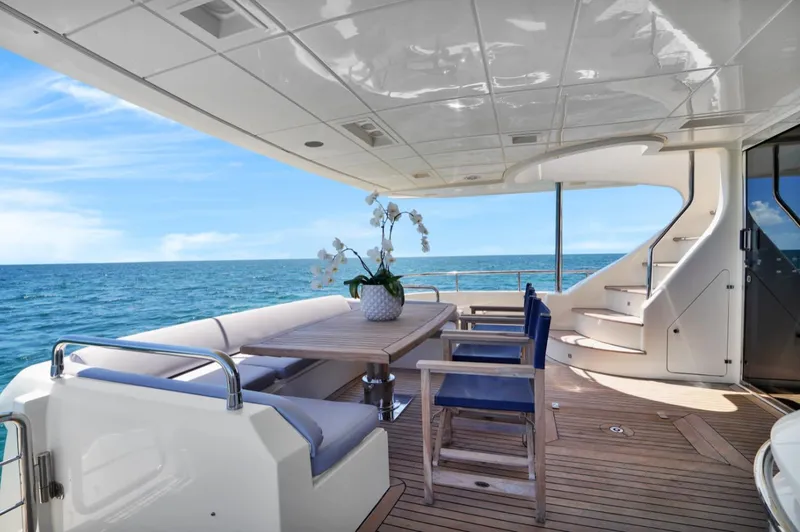 The Image of Luxurious 2009 Azimut 75 yacht deck with elegant seating and ocean view. - 41