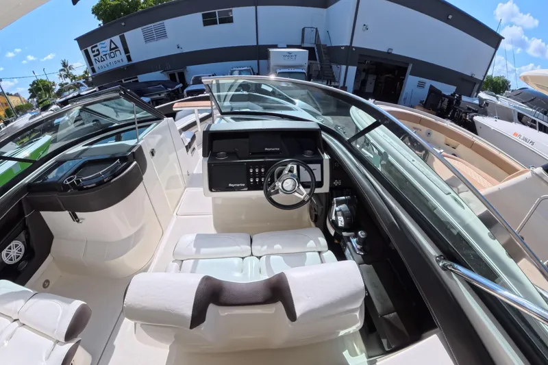 Slide: The Image of 2017 Sea Ray SLX 350 boat interior with modern dashboard and seating. - 17