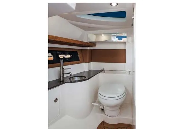 Slide: The Image of Manufacturer Provided Image: 2017 Sea Ray SLX 350 boat bathroom with sink, toilet, and modern design. - 6
