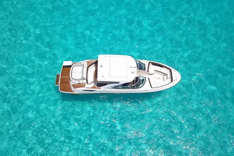 Slide: The Image of 2017 Sea Ray SLX 350 yacht on clear turquoise water, aerial view. - 9