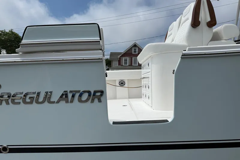 Slide: The Image of 2026 Regulator 31 boat with sleek design and comfortable seating. - 13