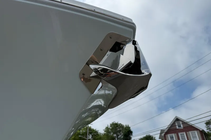 Slide: The Image of Bow of 2026 Regulator 31 boat with stainless steel anchor, cloudy sky background. - 16