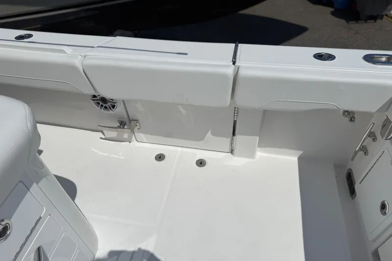 Slide: The Image of 2026 Regulator 31 boat interior, featuring white seating and deck details. - 50