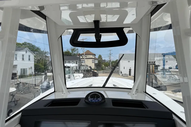 Slide: The Image of Interior view of 2026 Regulator 31 boat cockpit with clear windshield. - 8