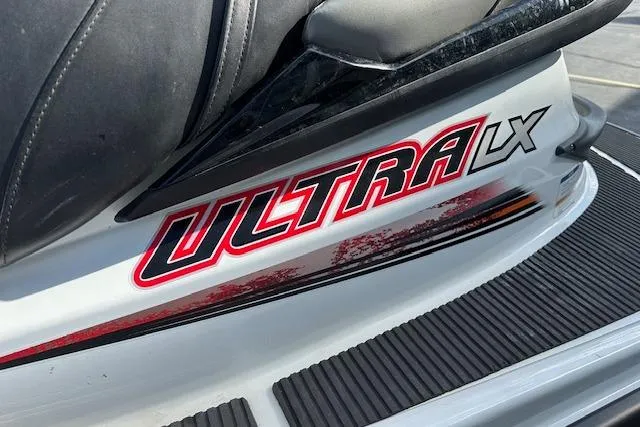 Slide: The Image of 2012 Kawasaki Ultra LX jet ski, close-up of logo and seat detail. - 5