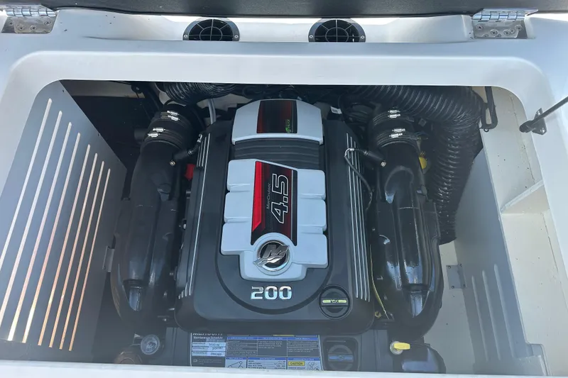 Slide: The Image of 2018 Sea Ray SPX 210 boat engine compartment with 4.5L 200 horsepower engine. - 24