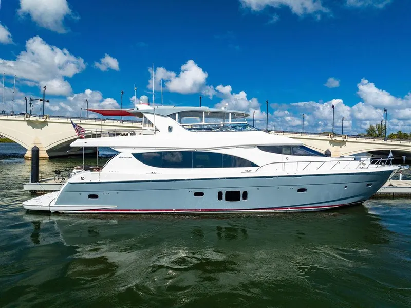 The Image of 2013 Hatteras 80 Motor Yacht docked under a clear blue sky. - 0