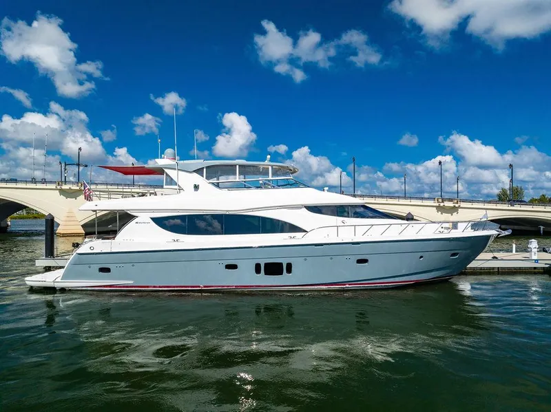 Slide: The Image of 2013 Hatteras 80 Motor Yacht docked under a clear blue sky. - 13