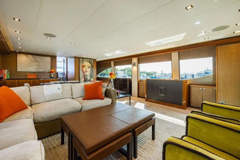 Slide: The Image of Luxurious interior of 2013 Hatteras 80 Motor Yacht with modern furnishings and large windows. - 35
