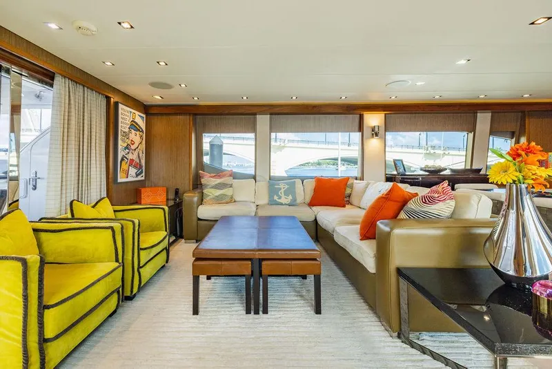 Slide: The Image of Luxurious interior of 2013 Hatteras 80 Motor Yacht with vibrant seating and elegant decor. - 39