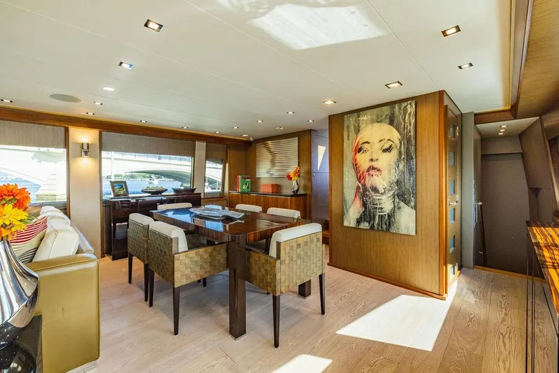 Slide: The Image of Luxurious interior of 2013 Hatteras 80 Motor Yacht with modern dining area and artwork. - 42