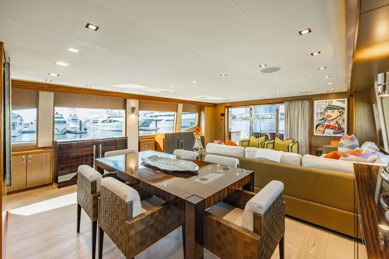 Slide: The Image of Luxurious interior of 2013 Hatteras 80 Motor Yacht with elegant dining and seating area. - 43