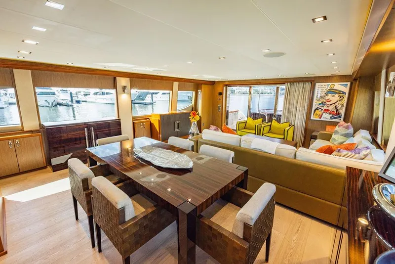 Slide: The Image of Luxurious interior of 2013 Hatteras 80 Motor Yacht with elegant dining and seating area. - 45