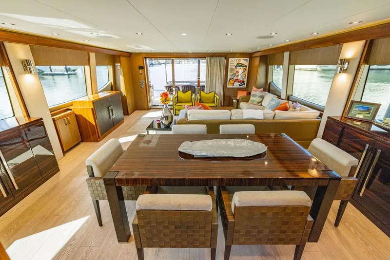 Slide: The Image of Luxurious interior of 2013 Hatteras 80 Motor Yacht with elegant dining and seating area. - 49