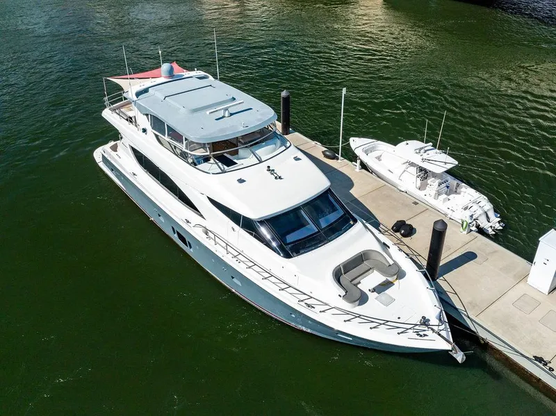 Slide: The Image of 2013 Hatteras 80 Motor Yacht docked on calm water. - 5