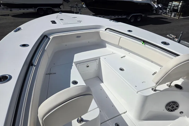 Slide: The Image of 2026 Sea Hunt Gamefish 25 boat interior with seating and storage compartments. - 12