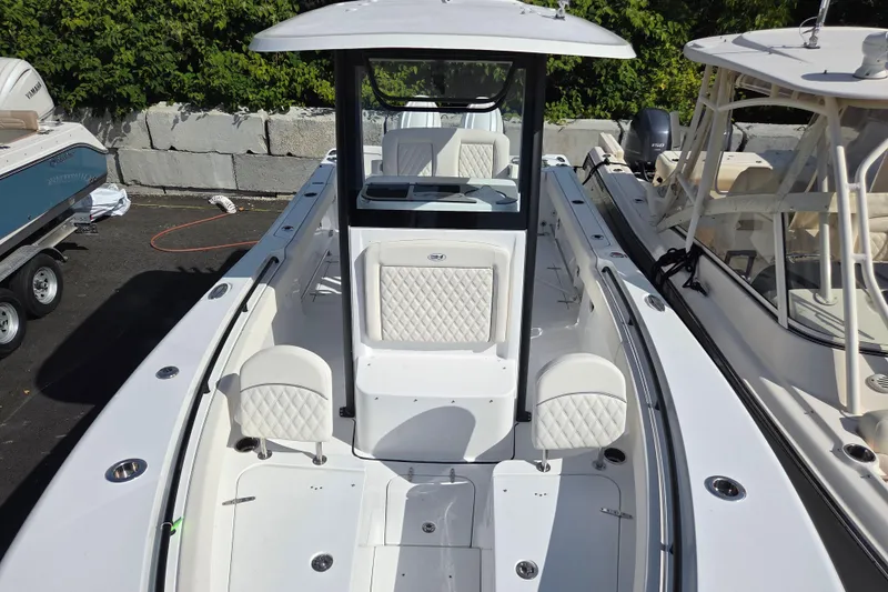 Slide: The Image of 2026 Sea Hunt Gamefish 25 boat with sleek design and comfortable seating. - 14