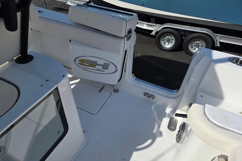 Slide: The Image of 2026 Sea Hunt Gamefish 25 boat interior, featuring seating and storage compartments. - 15