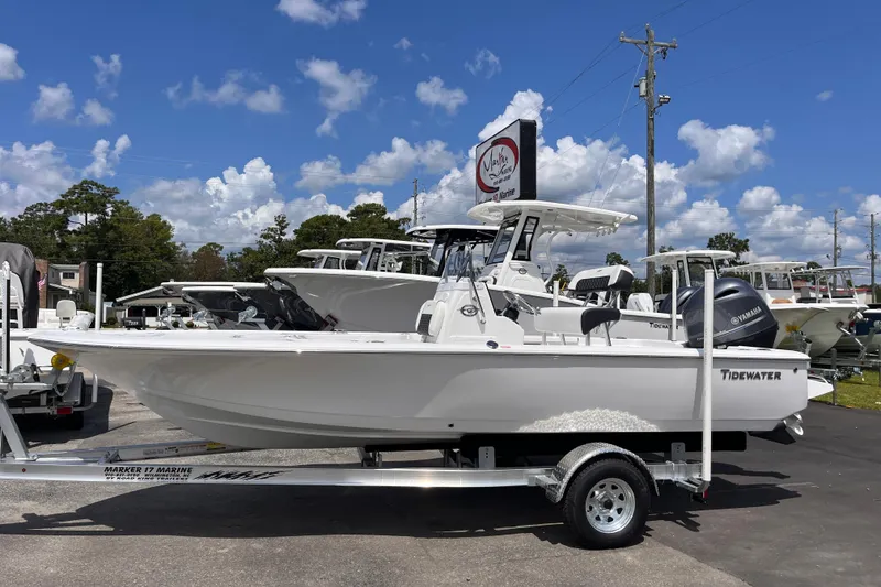 The Image of 2026 Tidewater 1910 Bay Max boat on trailer, displayed outdoors under a clear blue sky. - 0