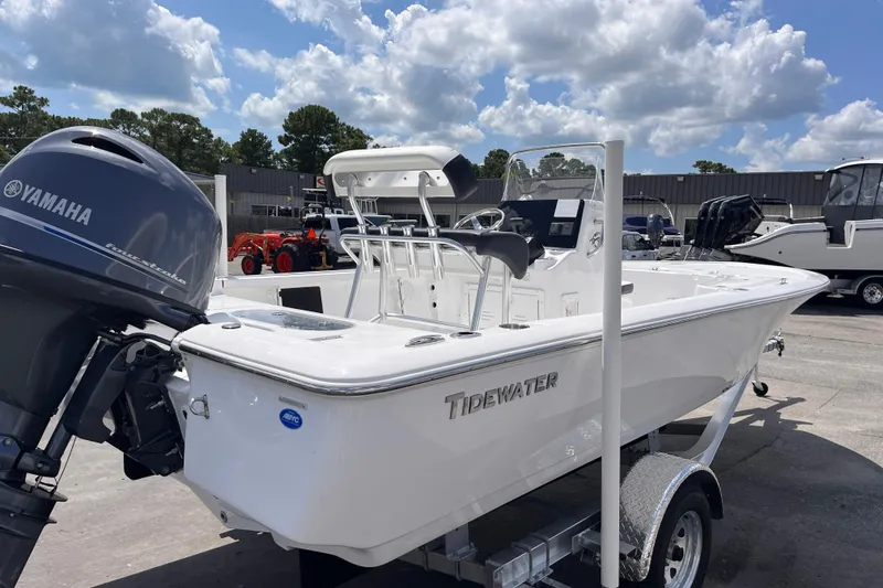 Slide: The Image of 2026 Tidewater 1910 Bay Max boat with Yamaha engine on trailer, under cloudy sky. - 4