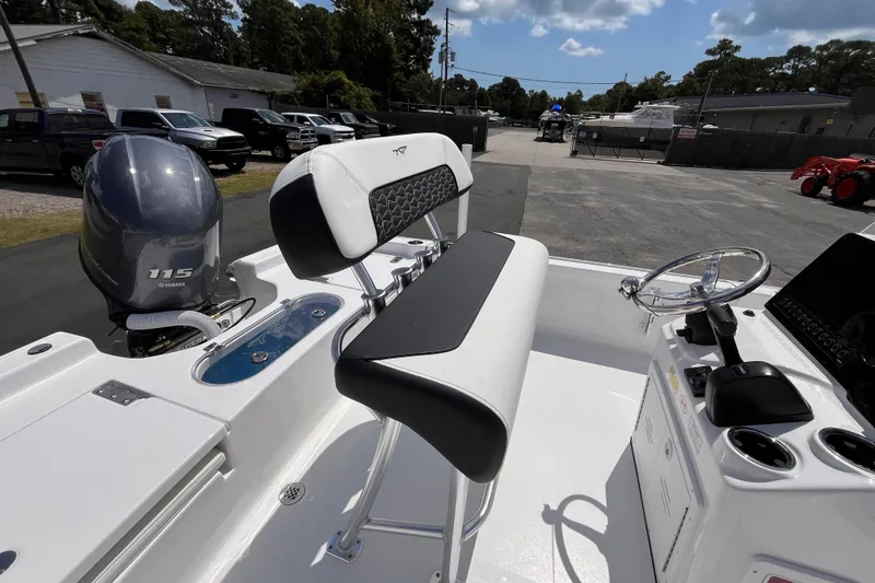 Slide: The Image of 2026 Tidewater 1910 Bay Max boat interior with Yamaha 115 engine, featuring sleek seating and controls. - 6