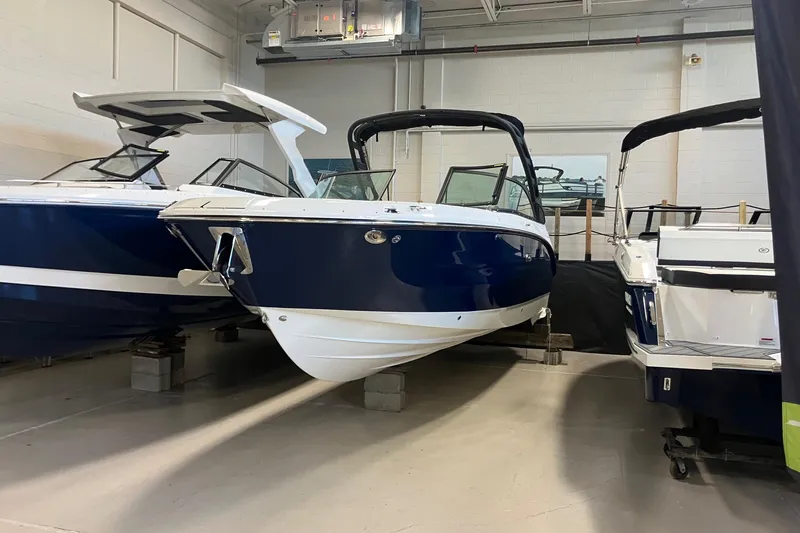 The Image of 2025 Sea Ray SDX 270 boats displayed in a showroom, showcasing sleek design and modern features. - 0