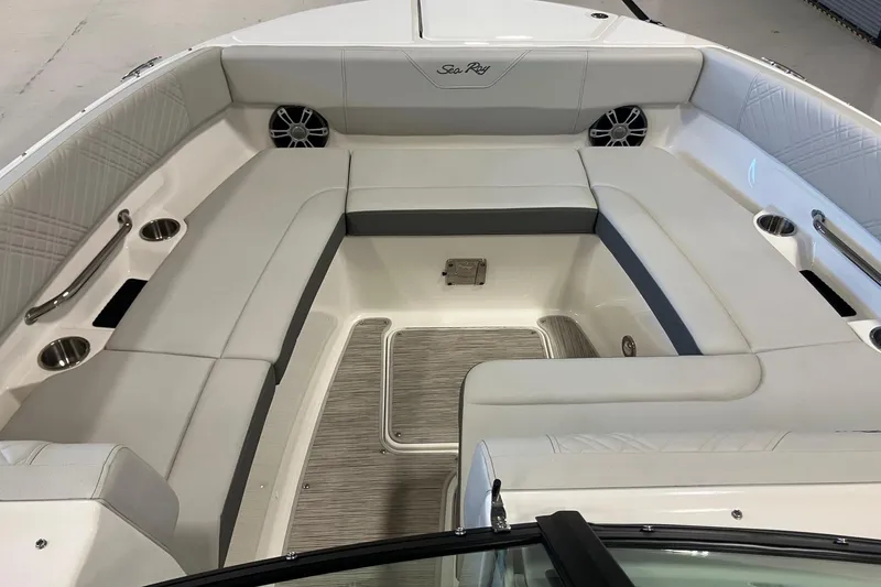 Slide: The Image of 2025 Sea Ray SDX 270 boat interior with spacious seating and cup holders. - 13