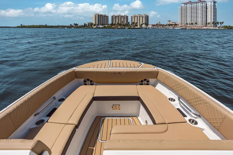 Slide: The Image of Manufacturer Provided Image: 2025 Sea Ray SDX 270 boat interior with waterfront cityscape in background. - 23