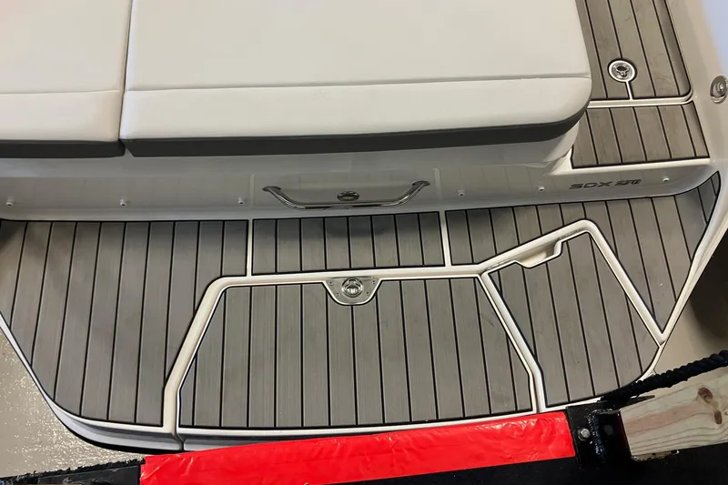 Slide: The Image of 2025 Sea Ray SDX 270 boat deck with cushioned seating and sleek design. - 3