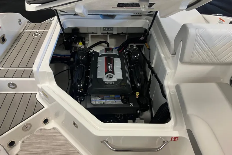 Slide: The Image of 2025 Sea Ray SDX 270 boat engine compartment with open hatch, showcasing powerful engine. - 6