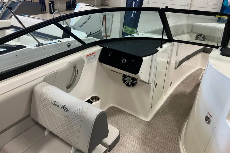 Slide: The Image of 2025 Sea Ray SDX 270 boat interior with seating and dashboard. - 9