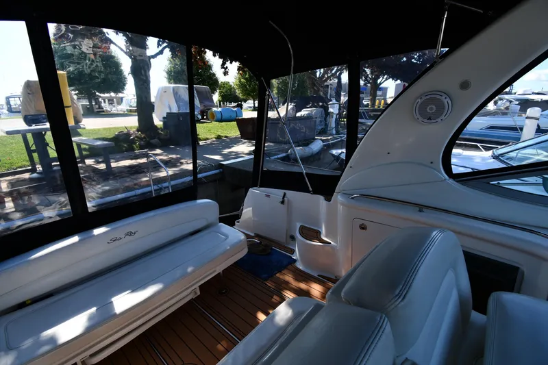 Slide: The Image of Interior of 2005 Sea Ray 300 Sundancer boat with seating and windows. - 18