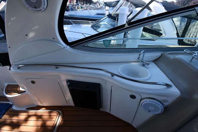 Slide: The Image of Interior of 2005 Sea Ray 300 Sundancer boat with sink and speaker. - 20