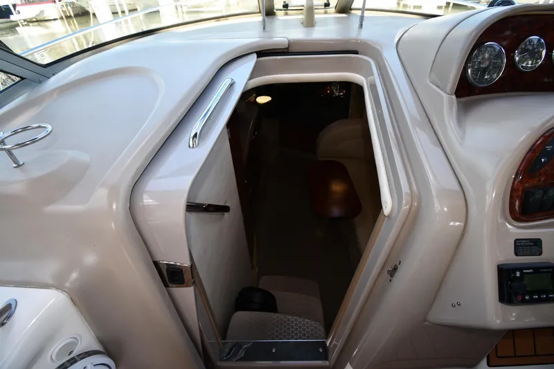 Slide: The Image of 2005 Sea Ray 300 Sundancer cabin entrance with dashboard view. - 24