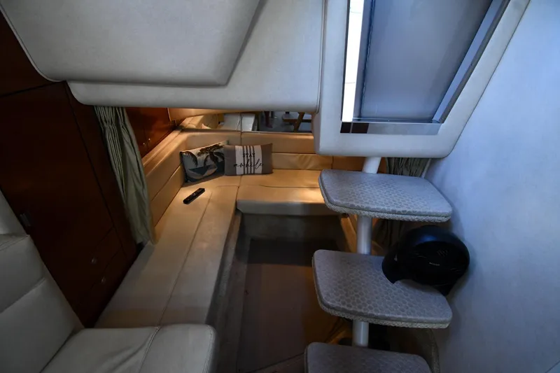 Slide: The Image of Interior of 2005 Sea Ray 300 Sundancer yacht with cozy seating and modern design. - 41