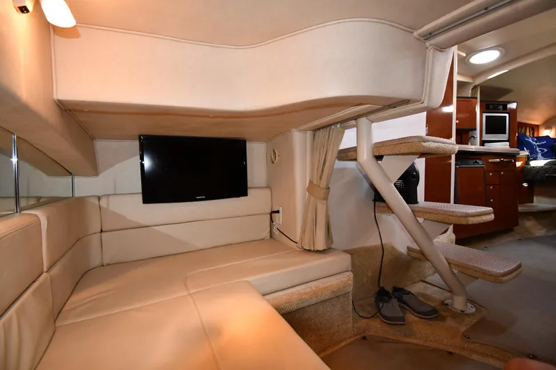 Slide: The Image of Interior of 2005 Sea Ray 300 Sundancer with cozy seating and modern amenities. - 43