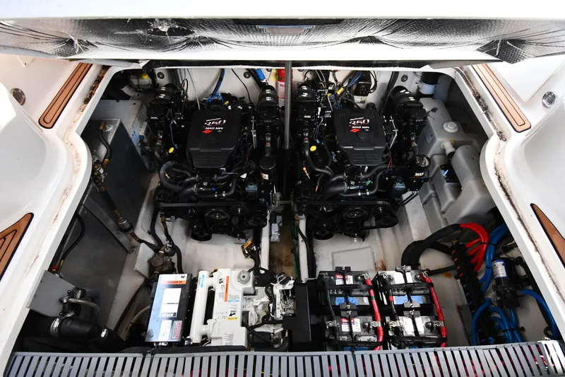 Slide: The Image of Engine compartment of a 2005 Sea Ray 300 Sundancer with twin MerCruiser engines. - 46