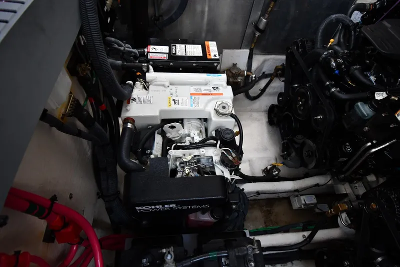 Slide: The Image of Engine compartment of a 2005 Sea Ray 300 Sundancer with Kohler power system. - 48