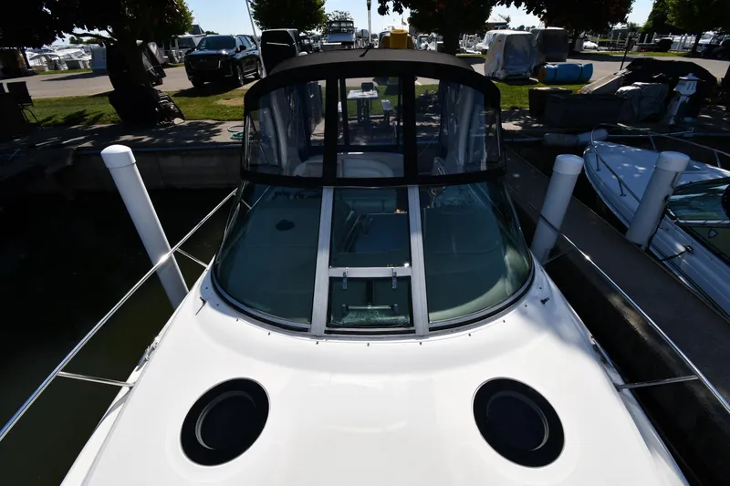 Slide: The Image of 2005 Sea Ray 300 Sundancer docked at marina, front view. - 7