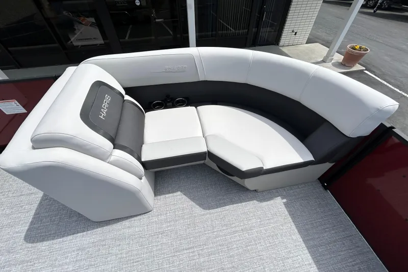 Slide: The Image of 2026 Harris FloteBote Cruiser 210 SL pontoon boat seating, featuring luxurious white and gray upholstery. - 10