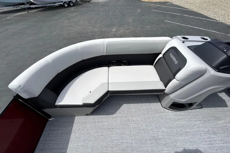 Slide: The Image of 2026 Harris FloteBote Cruiser 210 SL interior seating with modern design and cup holders. - 11