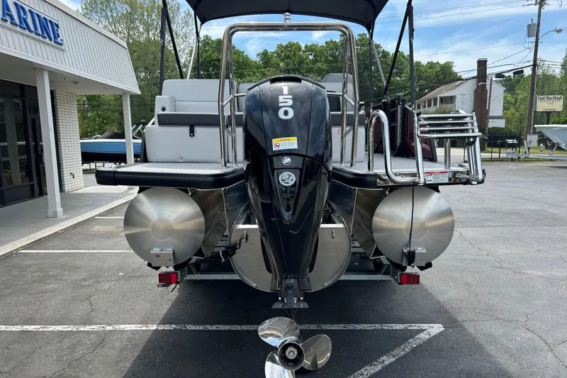 Slide: The Image of 2026 Harris FloteBote Cruiser 210 SL pontoon boat with powerful outboard motor. - 5