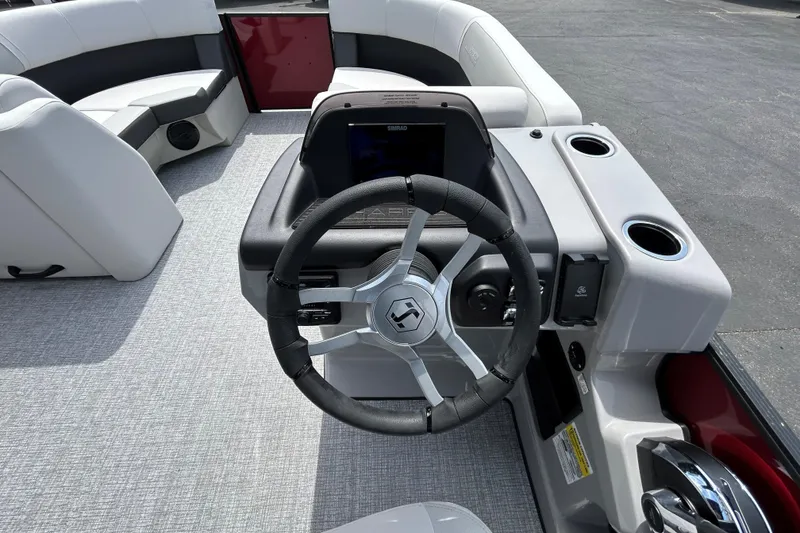 Slide: The Image of 2026 Harris FloteBote Cruiser 210 SL steering console with modern controls and seating. - 7