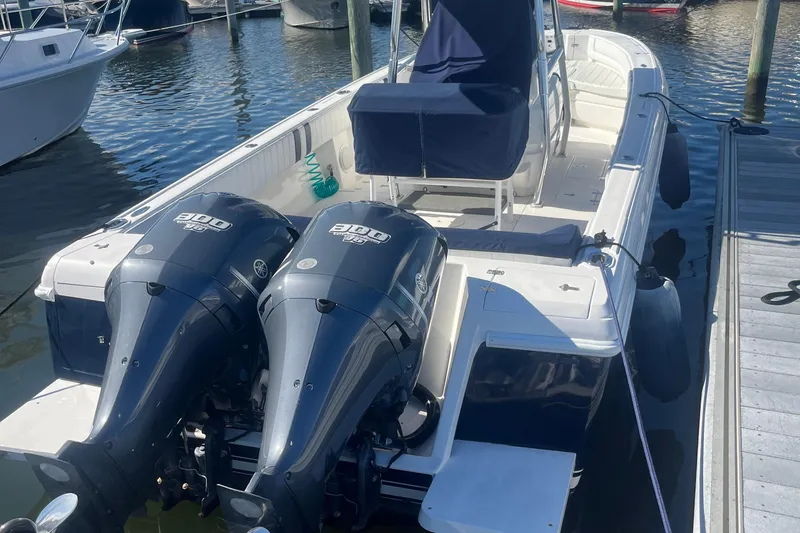 Slide: The Image of 2004 Intrepid 323 boat with dual engines docked at marina. - 1