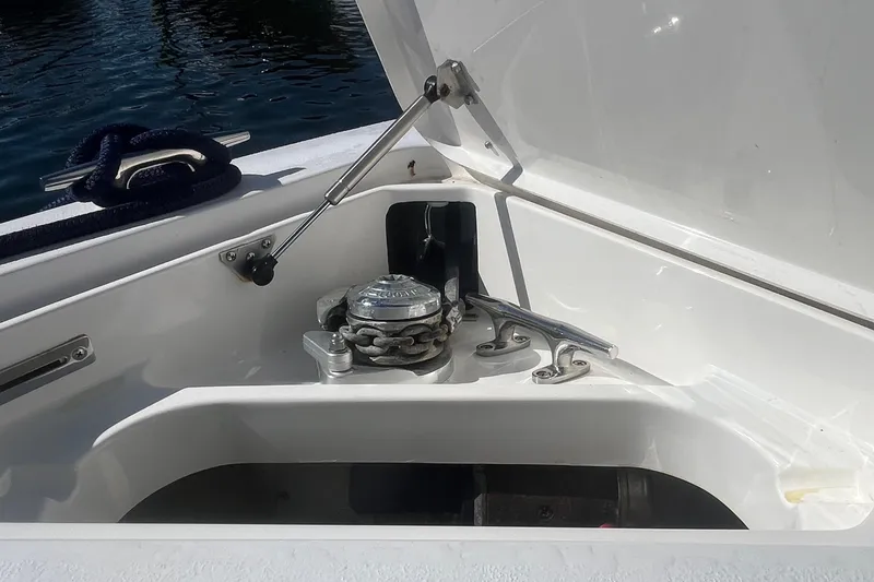 Slide: The Image of Anchor compartment of a 2004 Intrepid 323 boat with chain and cleat. - 6