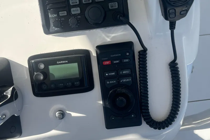 Slide: The Image of Control panel of a 2004 Intrepid 323 boat with Garmin and Icom devices. - 8